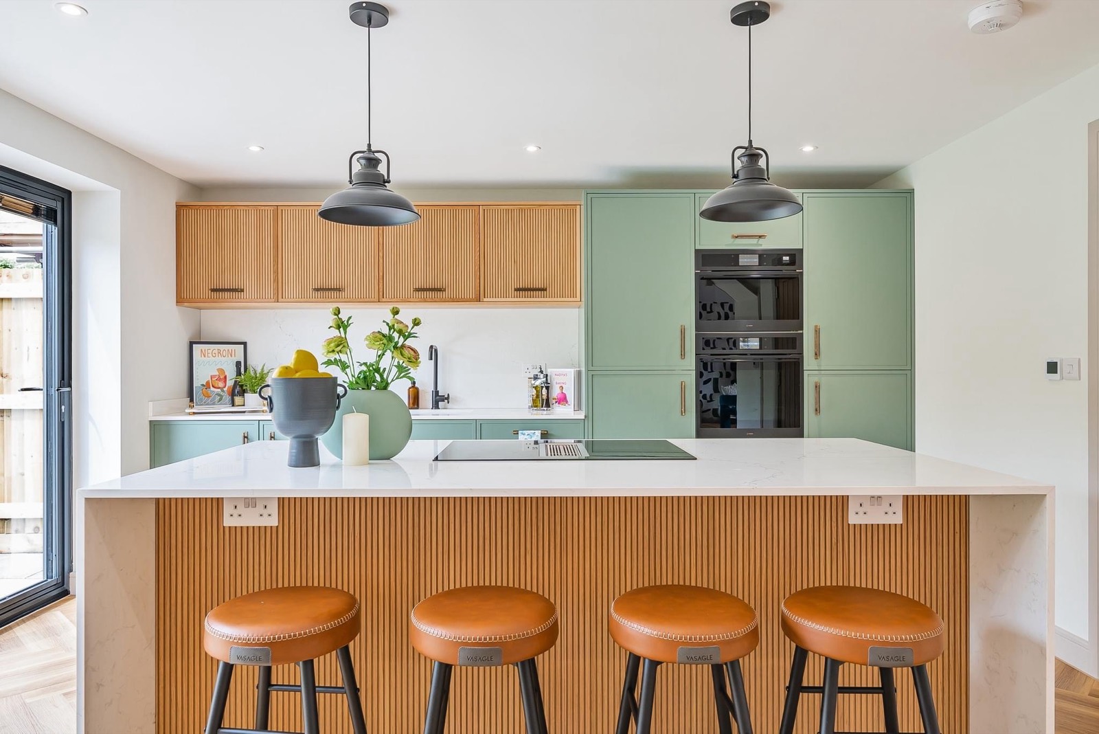 Fluted oak island with leather bar stools